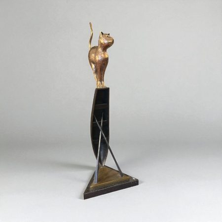 The sculpture in the image is titled "Aran Cat" by Irish sculptor Ian Pollock.